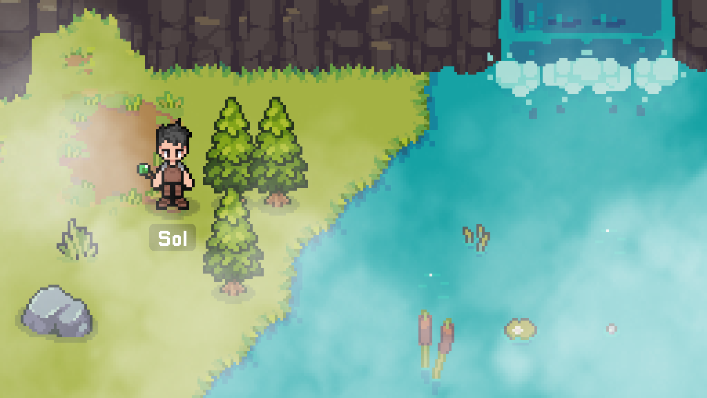 A foggy grassland next to a lake.